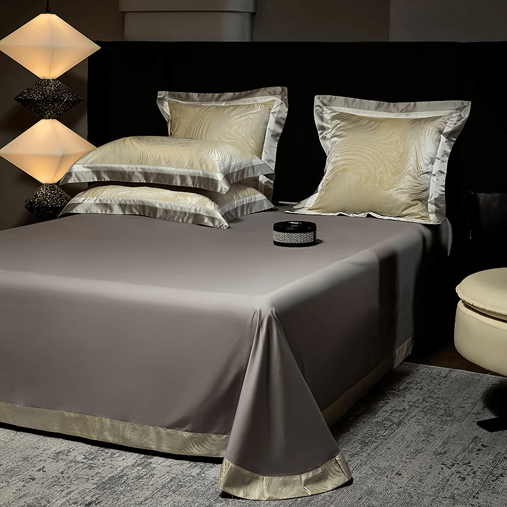 Elegant Egyptian Cotton Bedding Set with Marble Pattern on a luxurious bed, featuring satin-look edges and elegant pillows.
