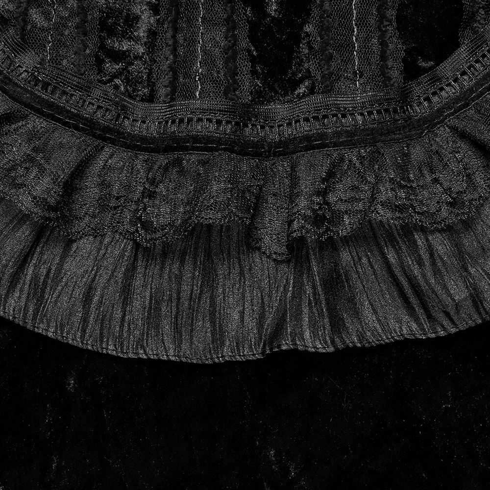 Close-up of elegant black velvet lace trim and ruffle detail on a gothic cape, showcasing retro design elegance.