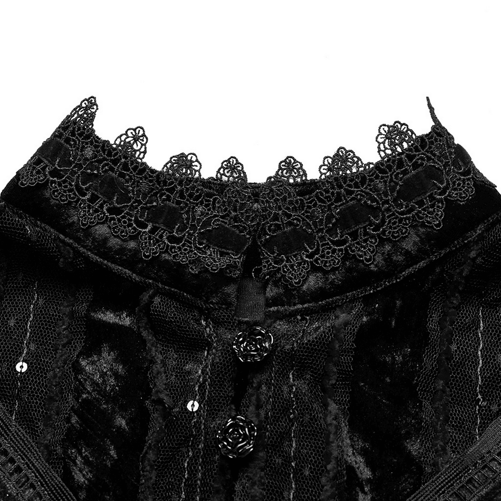 Close-up of a vintage-style black lace collar on an elegant embroidered goth cape.
