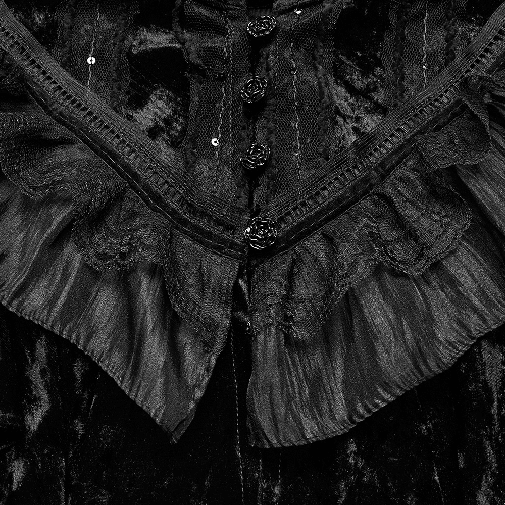 Close-up of elegant black velvet cape with lace trim and rose buckle, showcasing gothic vintage style.