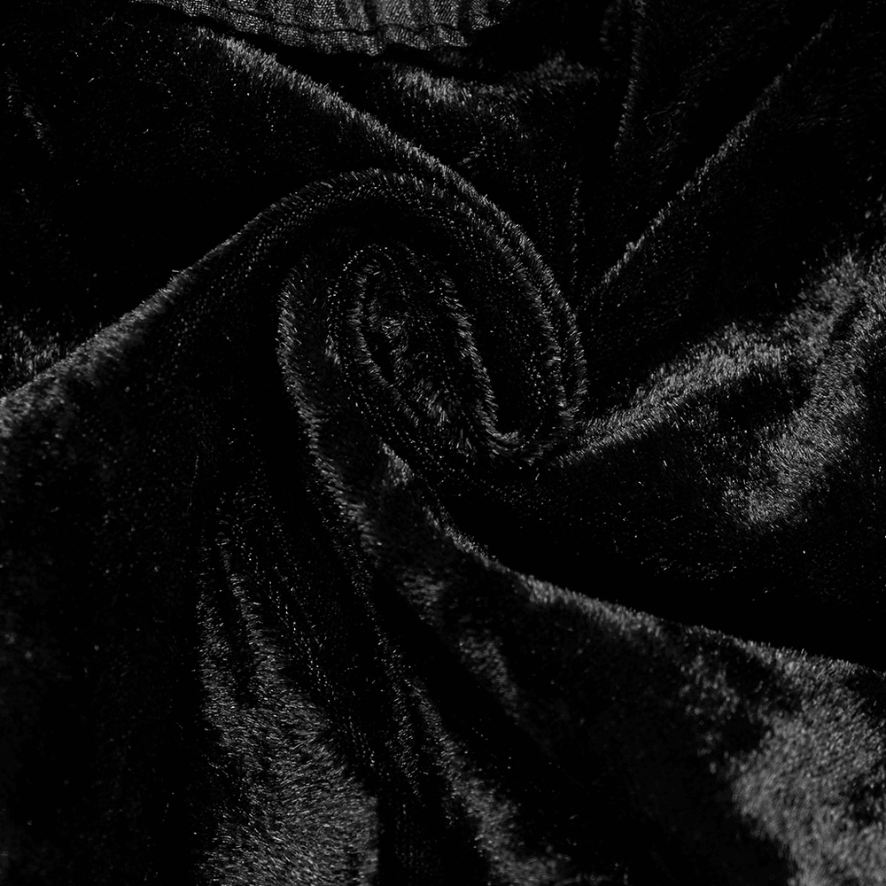 Close-up of luxurious black velvet fabric, showcasing smooth texture for an elegant gothic cape.