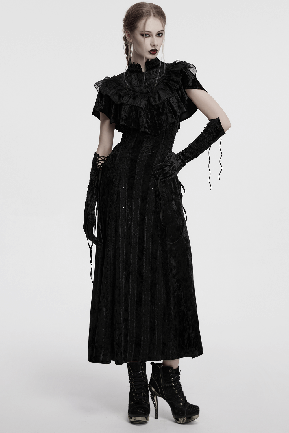 Elegant black velvet gothic dress with ruffles and long gloves, perfect for steampunk and Victorian styles.