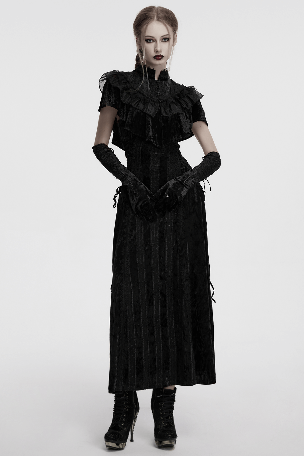 Elegant black gothic dress with ruffled sleeves, long skirt, and gloves for a vintage steampunk look.