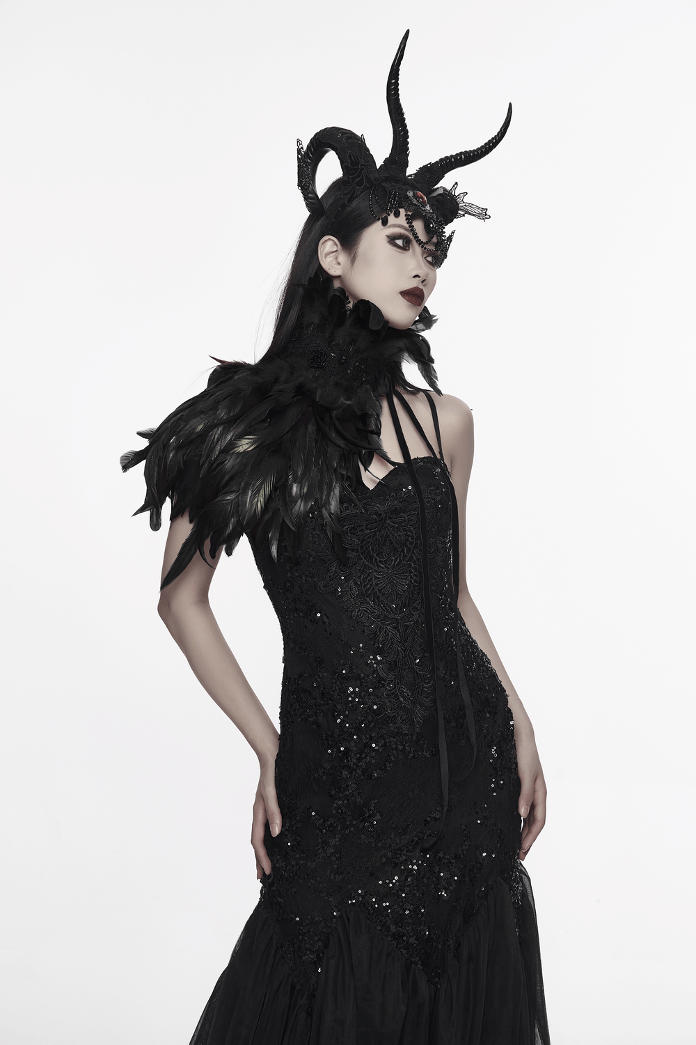 Model showcasing an elegant dark feather neck collar and shoulder epaulette, perfect for gothic fashion and festivals.