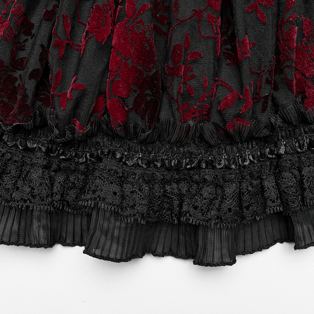Close-up of red floral pattern on black mesh fabric with lace trim for a gothic crop top.