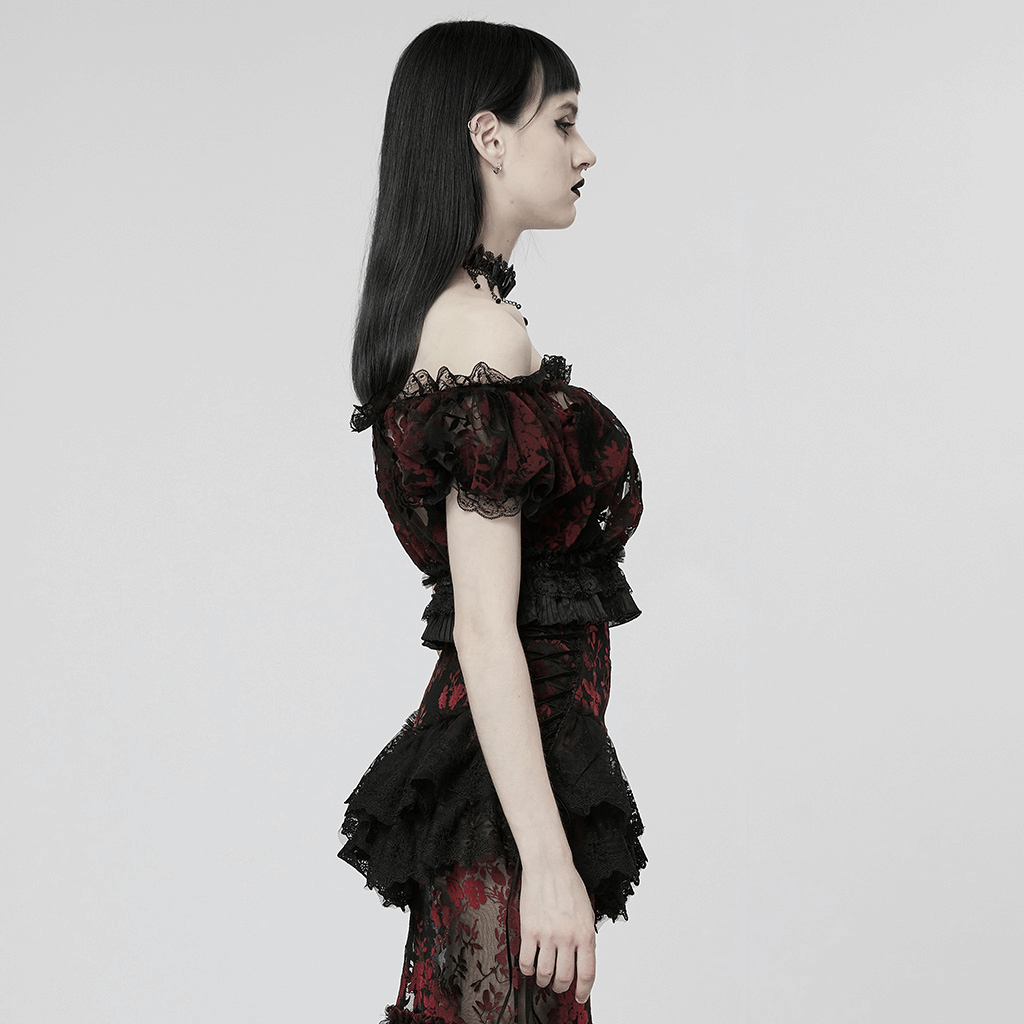 Side view of a model in an elegant floral gothic flock mesh crop top with lace trim and bubble sleeves.