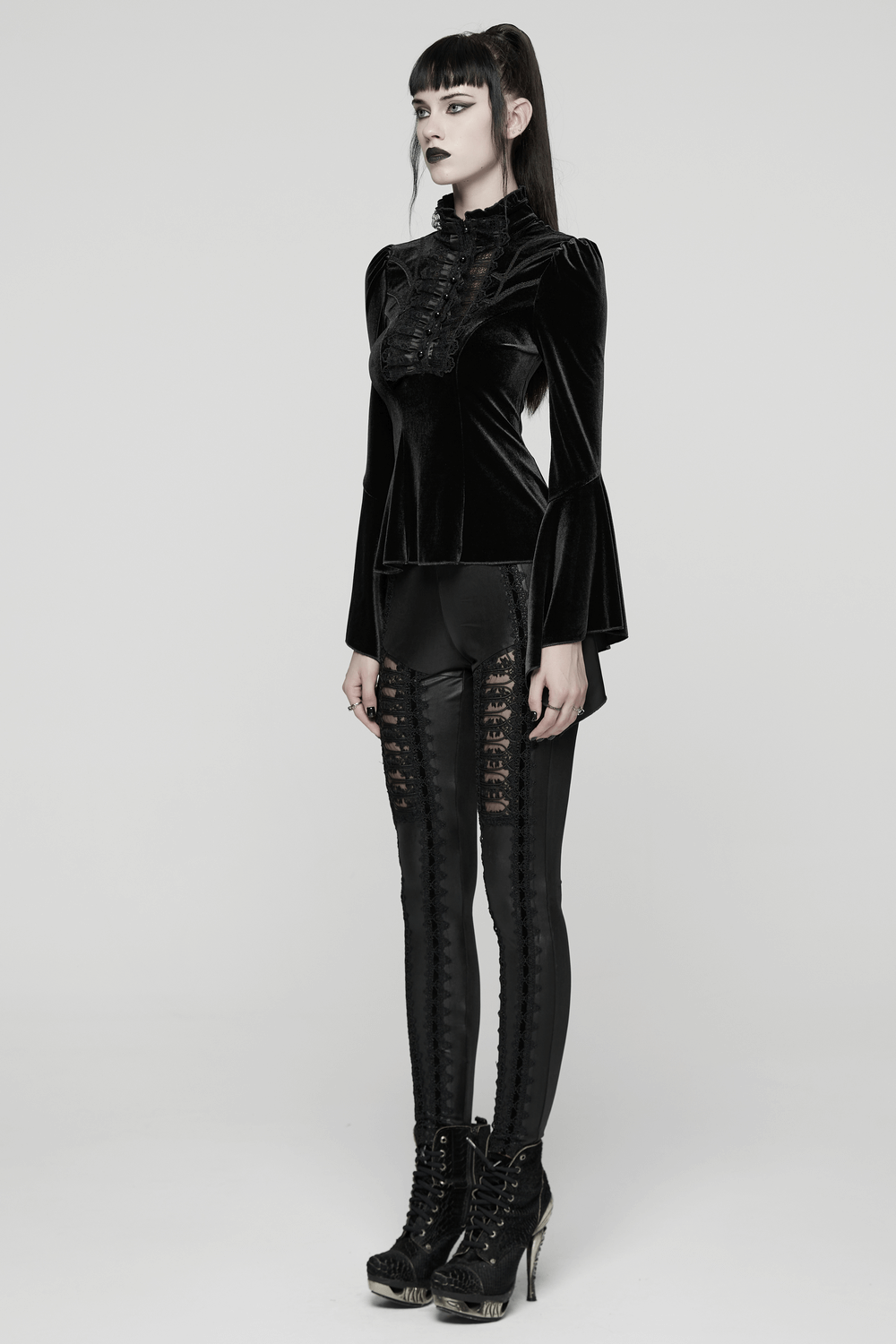 Elegant Goth Top with Ruffled Lace and Pearl Buttons worn with stylish black pants and high-heeled boots.