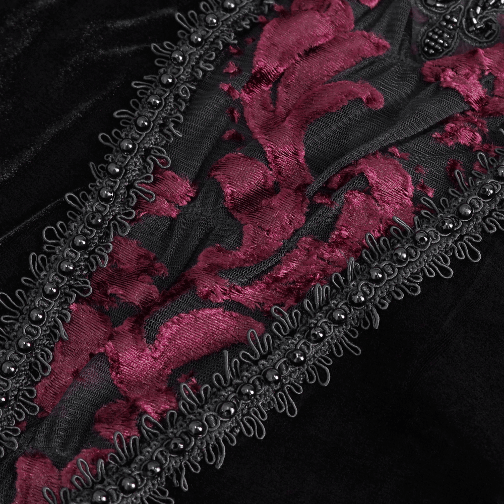 Close-up of elegant goth velvet top featuring rich burgundy lace details and intricate bead embellishments.
