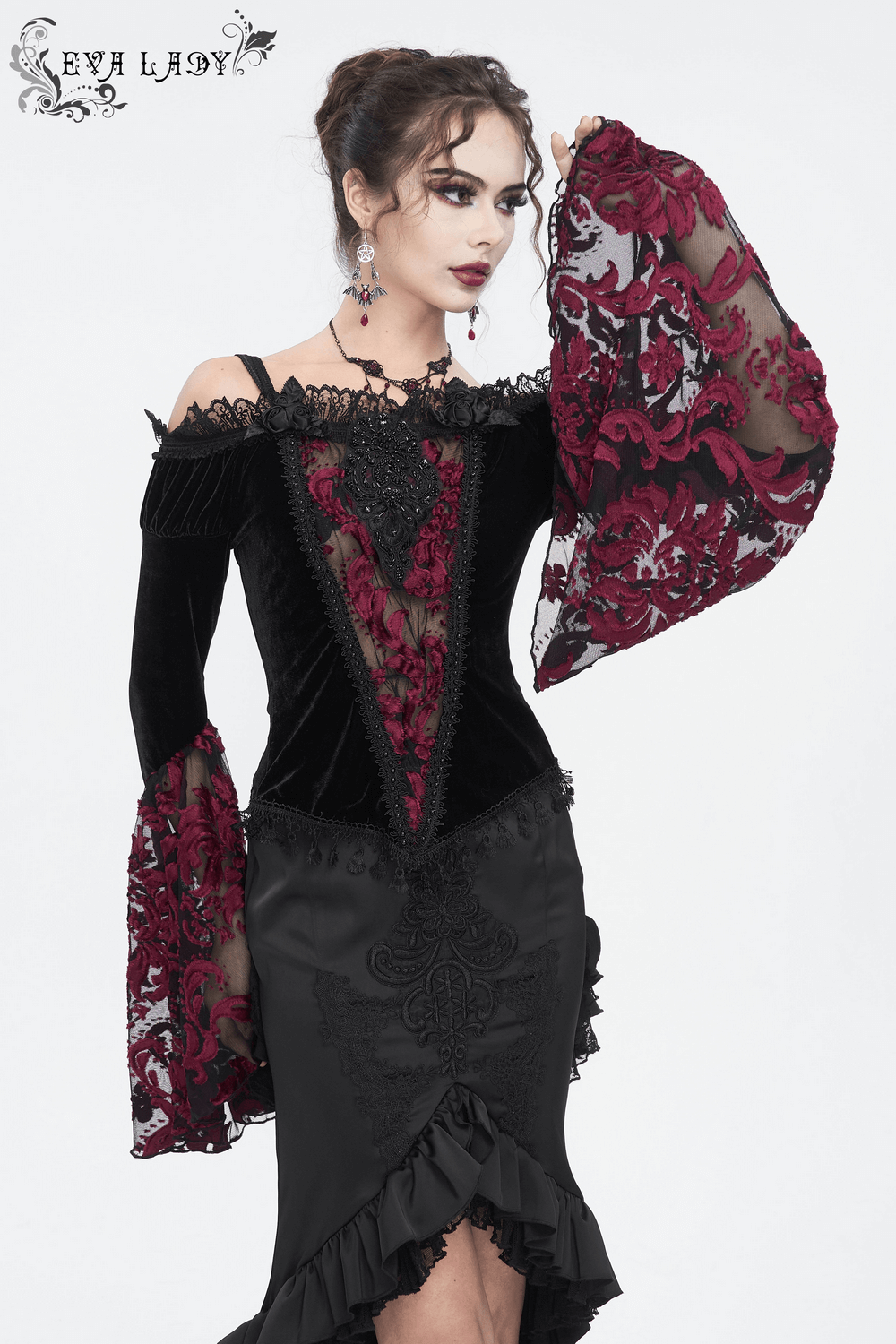 Elegant goth velvet top with lace bell sleeves, perfect for a dramatic night out or special occasion.