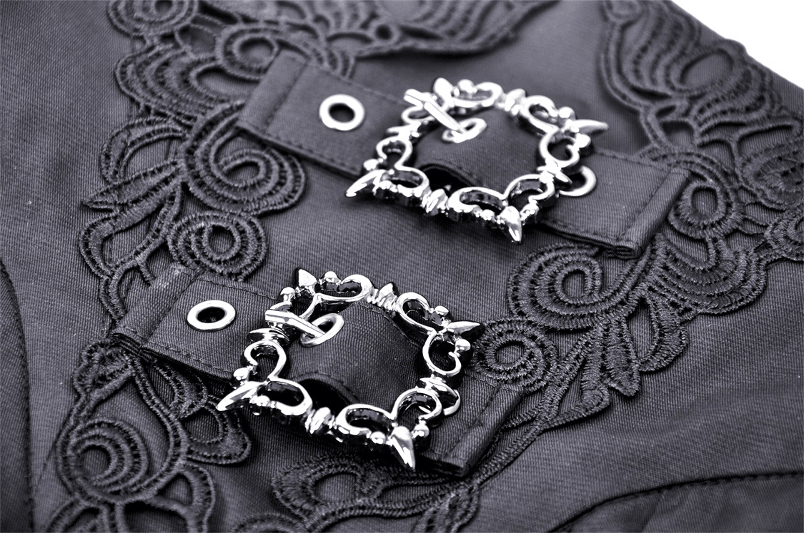Close-up of intricate black lace detailing and stylish silver buckles on a gothic garment.