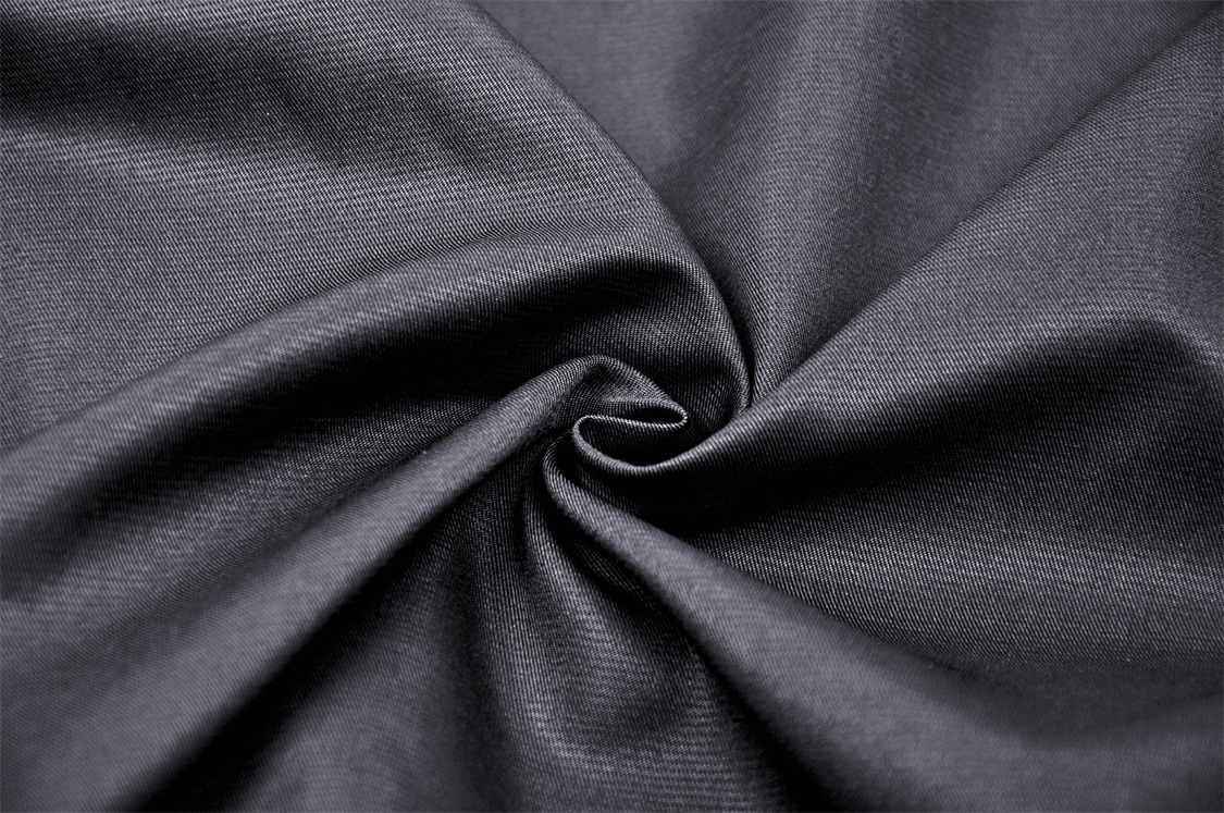 Close-up of soft black fabric ideal for elegant gothic clothing and stylish A-line skirts.