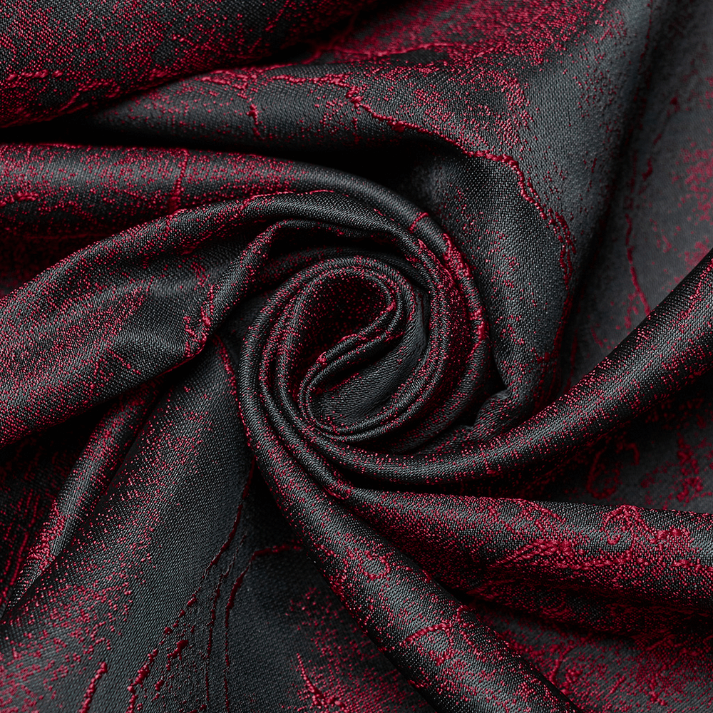 Close-up of luxurious black and burgundy jacquard fabric, showcasing intricate texture for gothic formal wear.