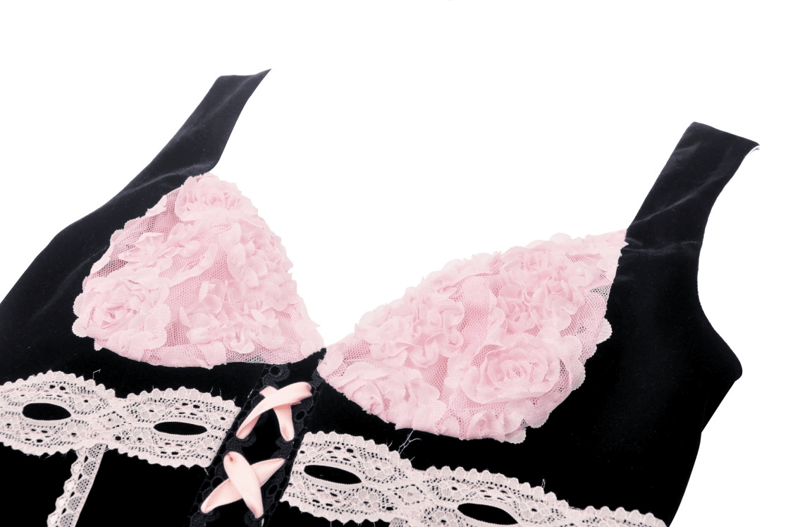 Elegant black corset top with pink lace accents and floral details, perfect for a gothic romantic look.