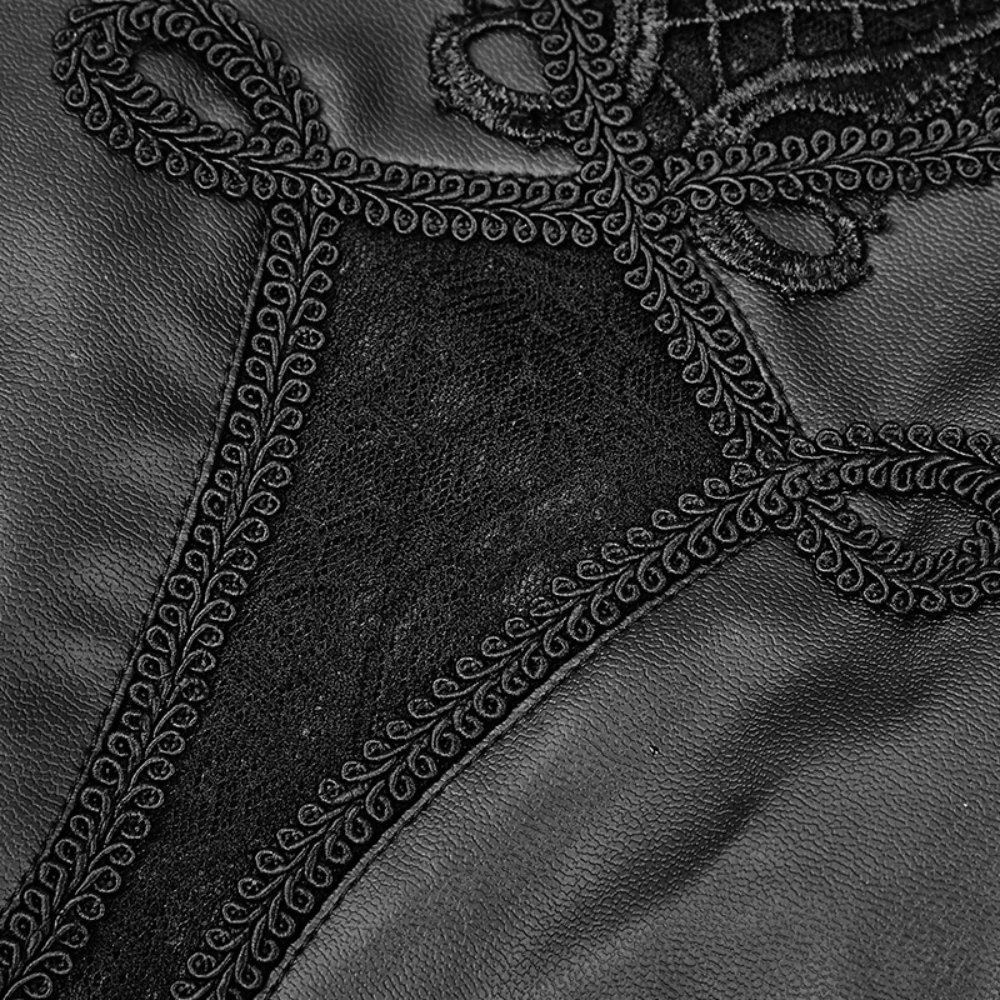 Close-up of intricate floral lace detailing on black faux leather leggings for an edgy gothic style.