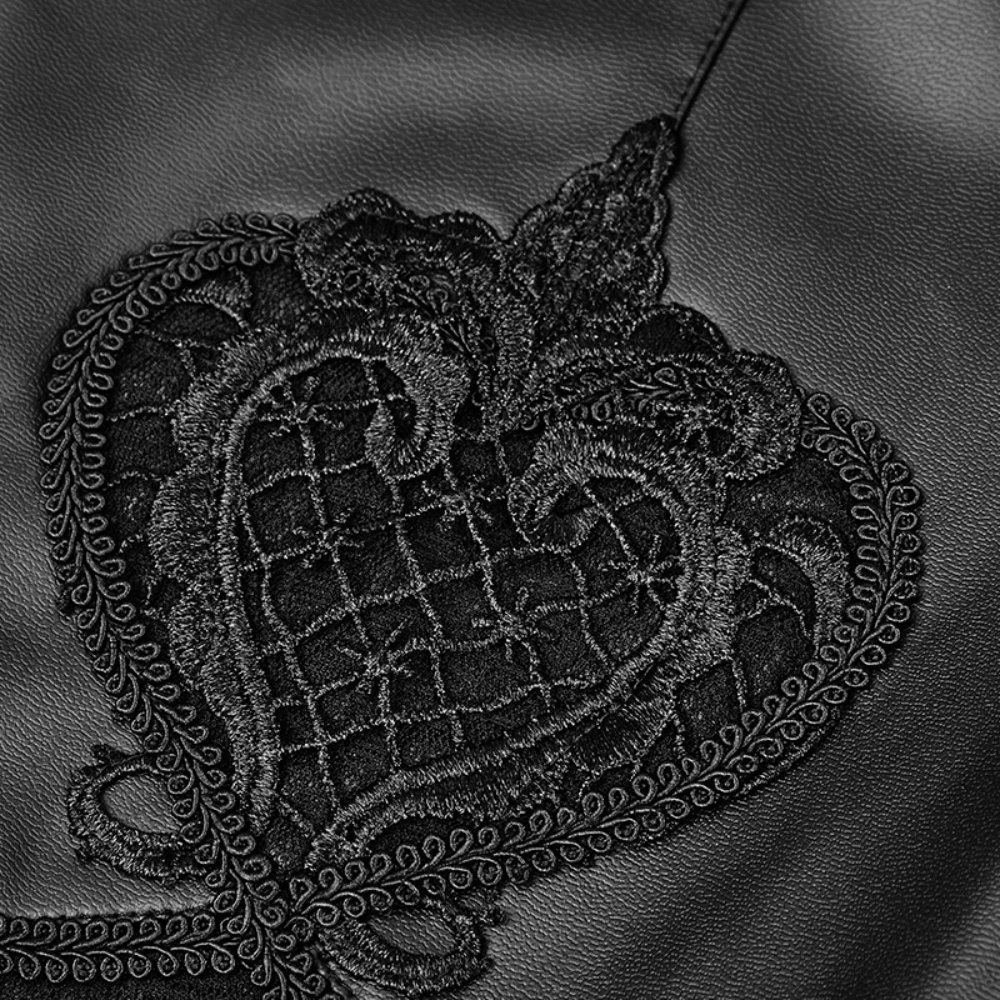 Intricate black lace heart design on faux leather leggings, perfect for gothic elegance and edgy style.