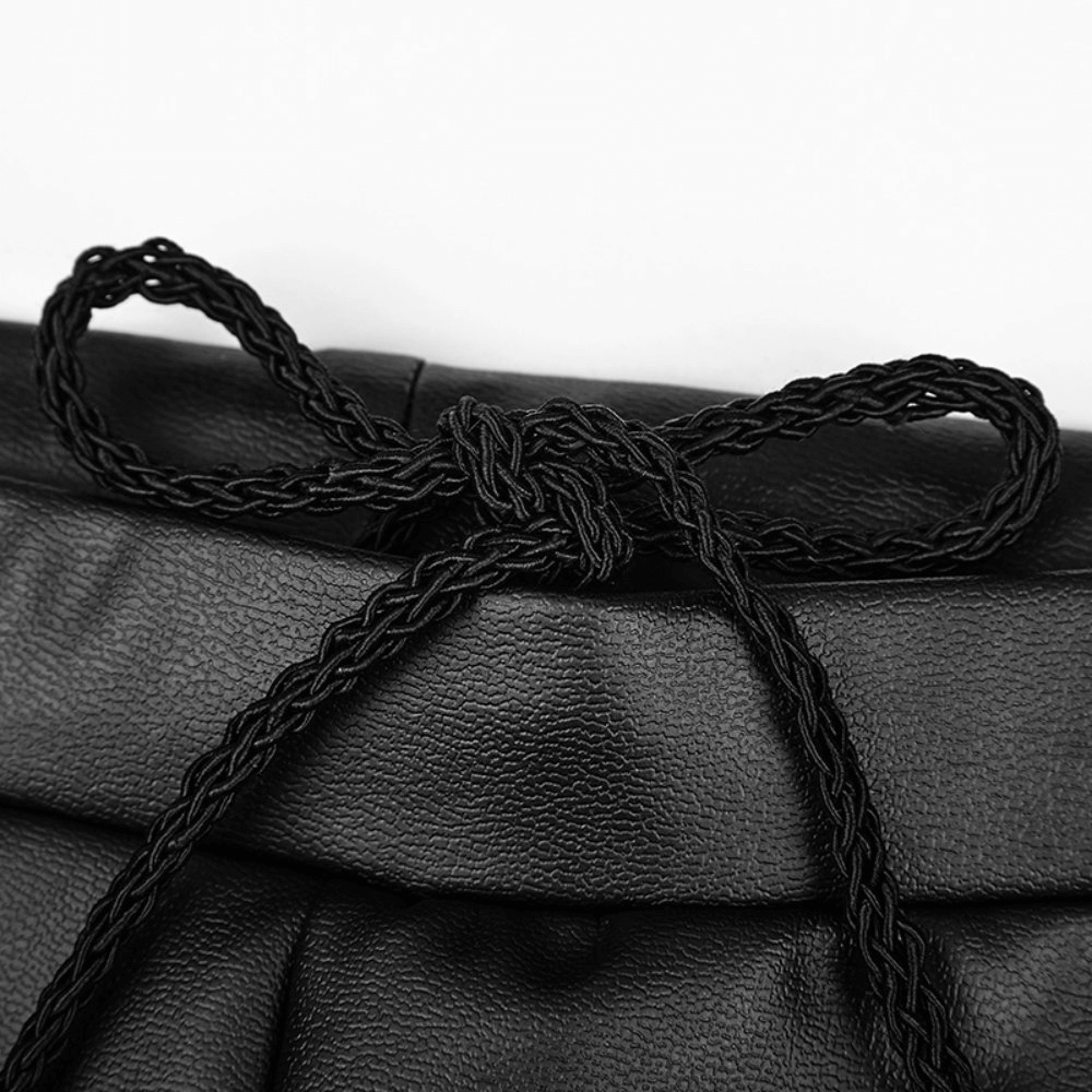 Close-up of a braided black ribbon tie on faux leather leggings adjustable waistband.