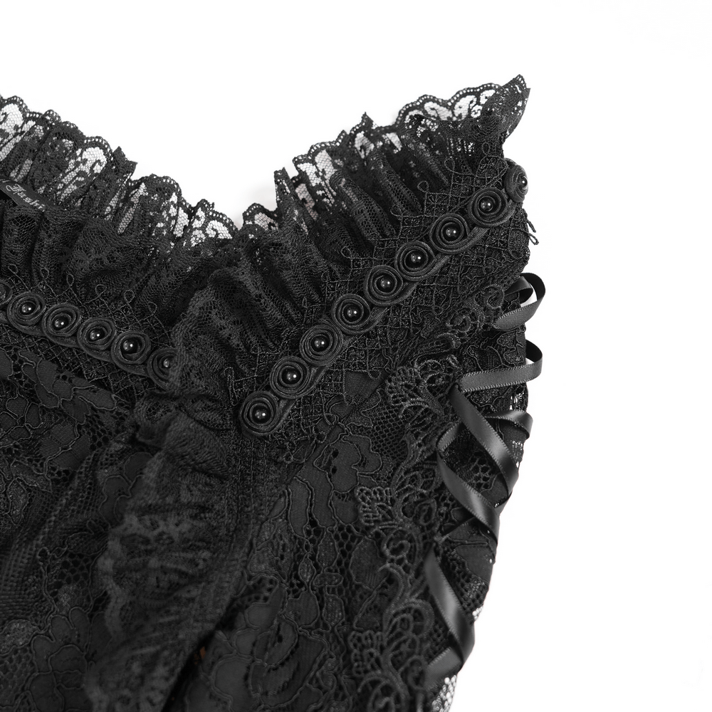 Close-up of elegant gothic black lace mini dress details, featuring intricate lace overlay and adjustable lace-up side accents.