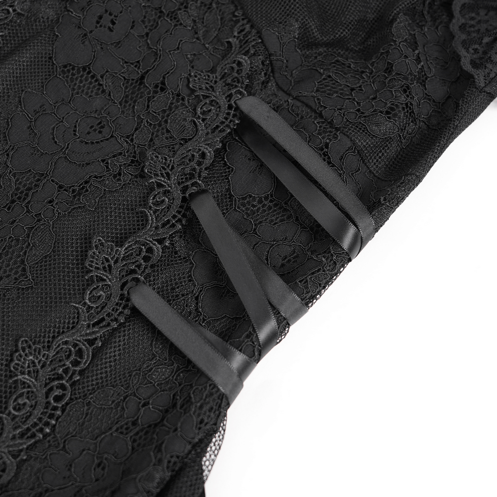 Close-up of black lace mini dress showcasing intricate lace details and stylish lace-up side ribbons.
