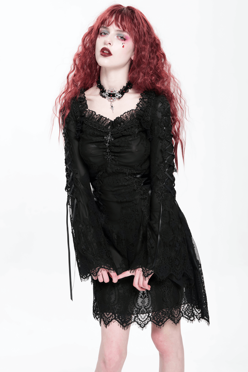 Elegant gothic black lace mini dress with bell sleeves and lace-up details, exuding dark romance.