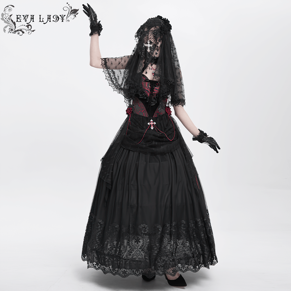 Elegant gothic woman in black mesh maxi skirt and veil with intricate embroidery and lace details.