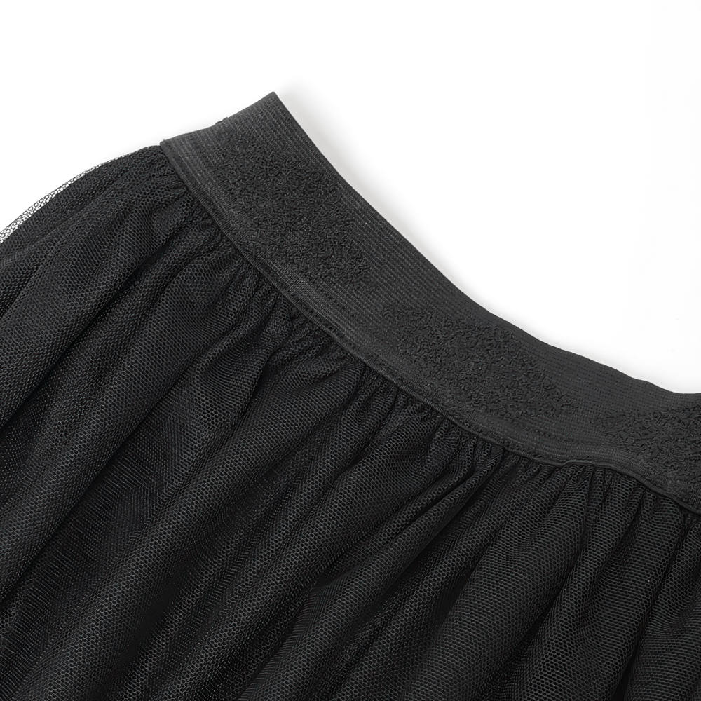 Close-up of the elastic waistband on an elegant gothic black mesh maxi skirt with intricate embroidered detail.