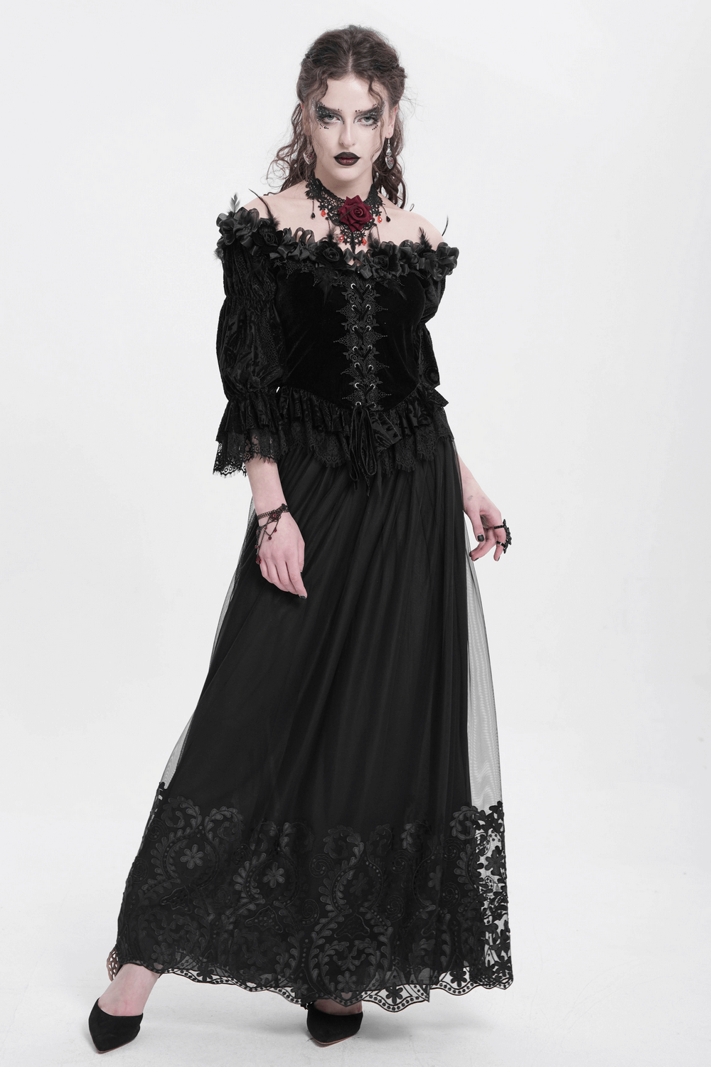 Elegant gothic model in black mesh maxi skirt with embroidered hem, styled for dark romantic outfits.