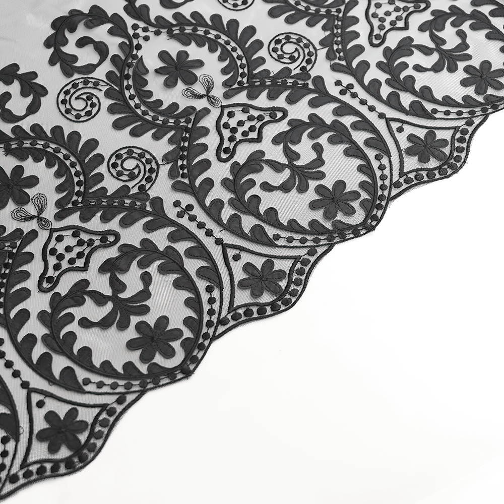 Intricate black embroidered floral patterns on mesh fabric, perfect for gothic and vintage-inspired fashion.