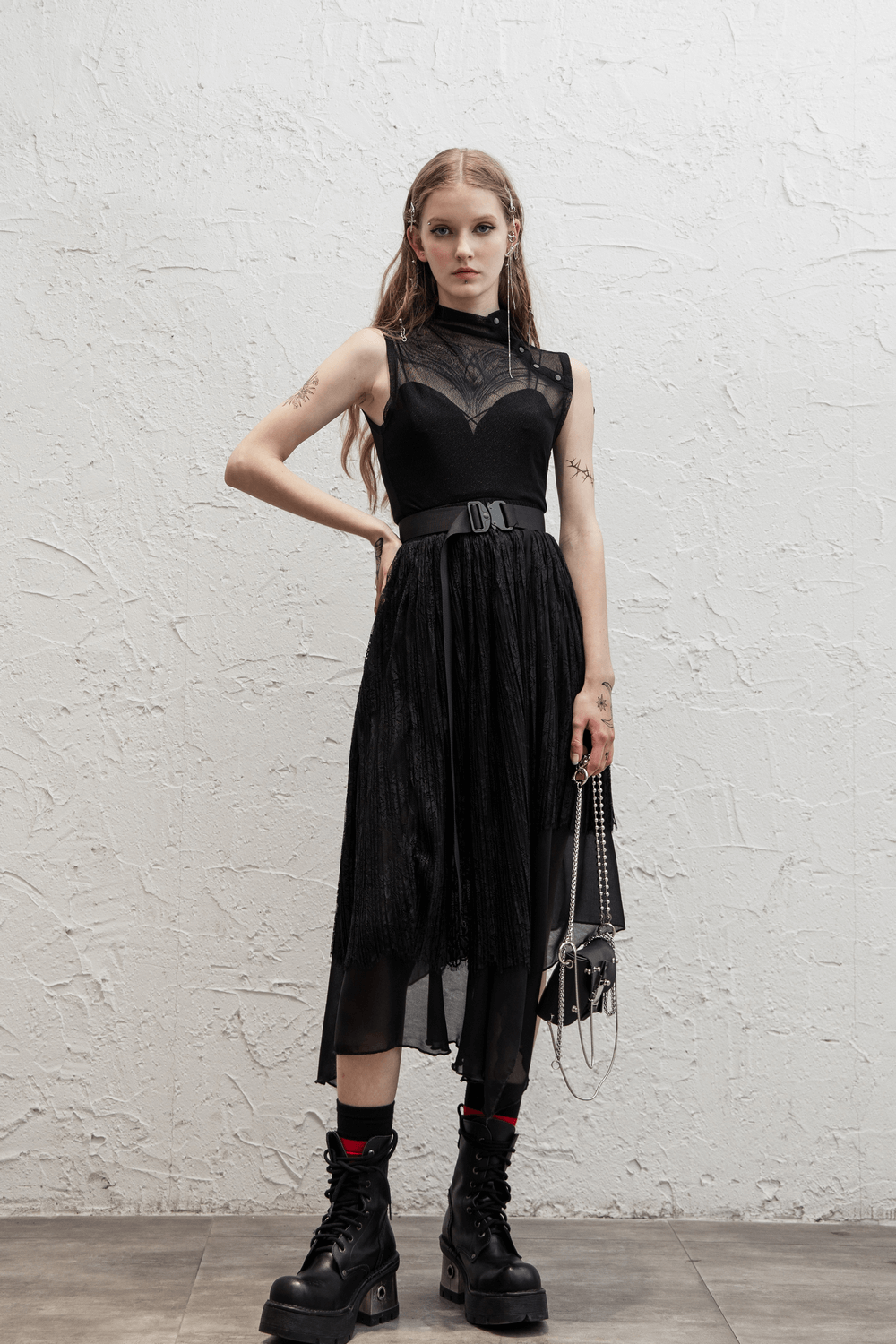 Elegant Gothic black mesh sleeveless top with high neck, edgy design, and stylish black boots.