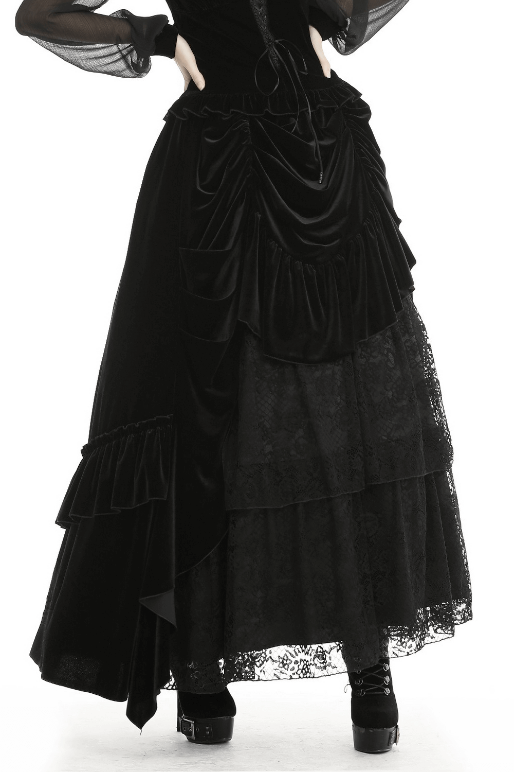 Elegant gothic black velvet and lace long skirt with ruffled details and layered design.