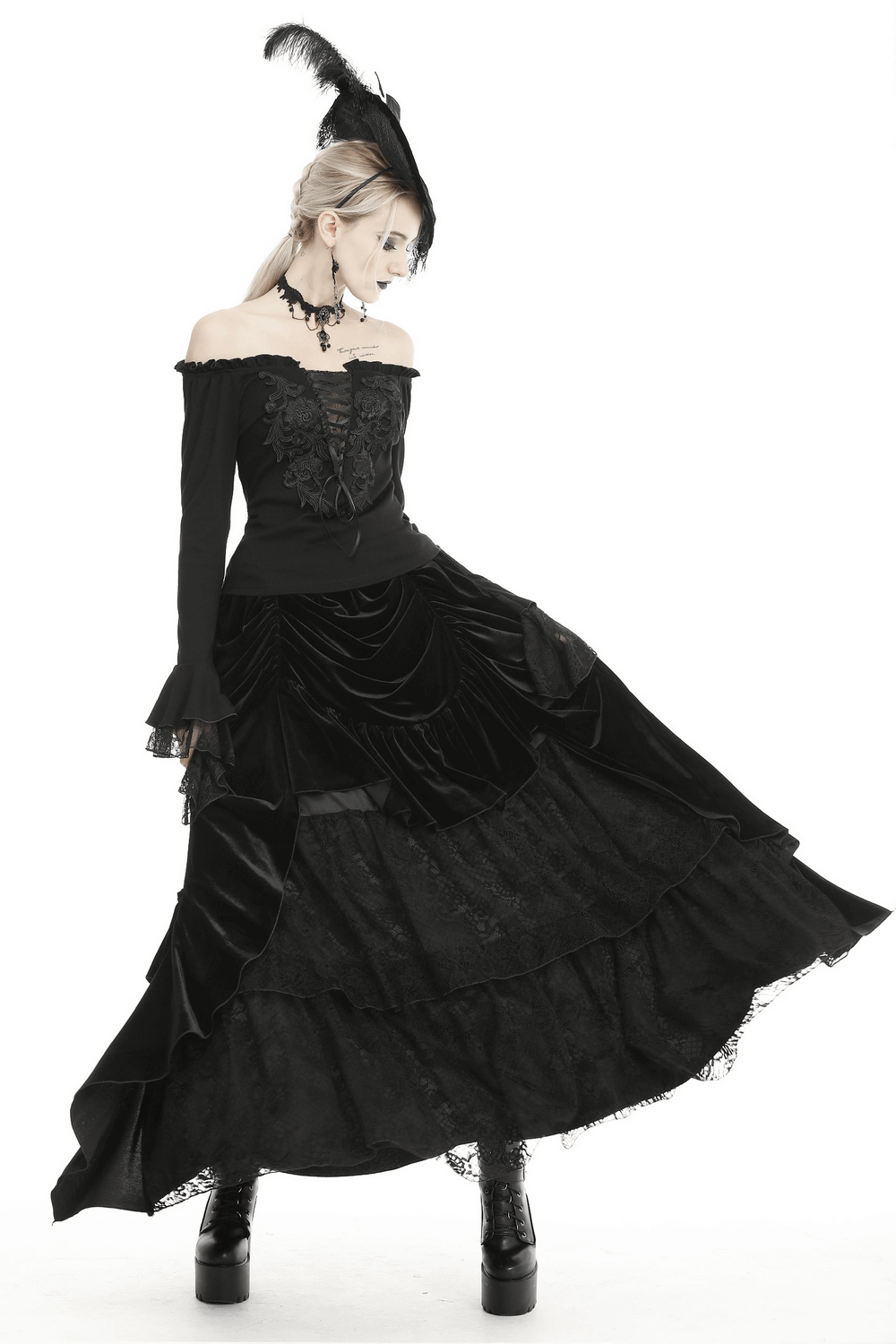 Gothic black velvet and lace long skirt worn elegantly, showing off its layered design and intricate lace details.