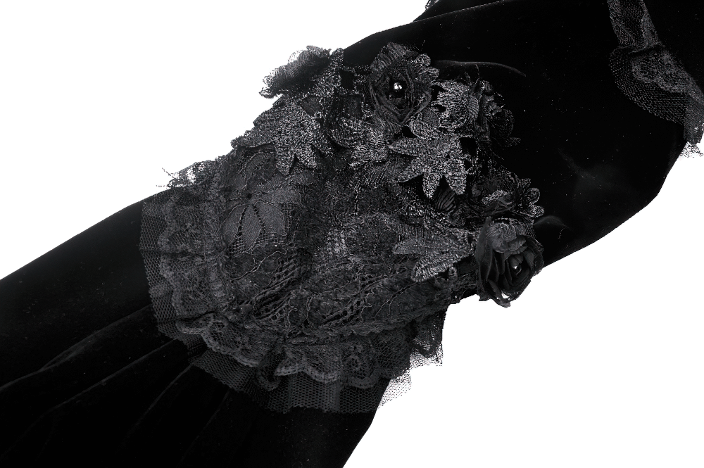 Close-up of elegant black velvet bolero with intricate lace and floral details, embodying gothic sophistication.