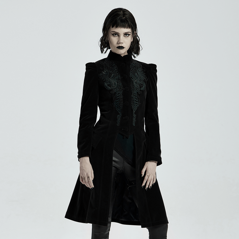 Elegant Gothic black velvet trench coat with intricate embroidery and a dramatic silhouette.