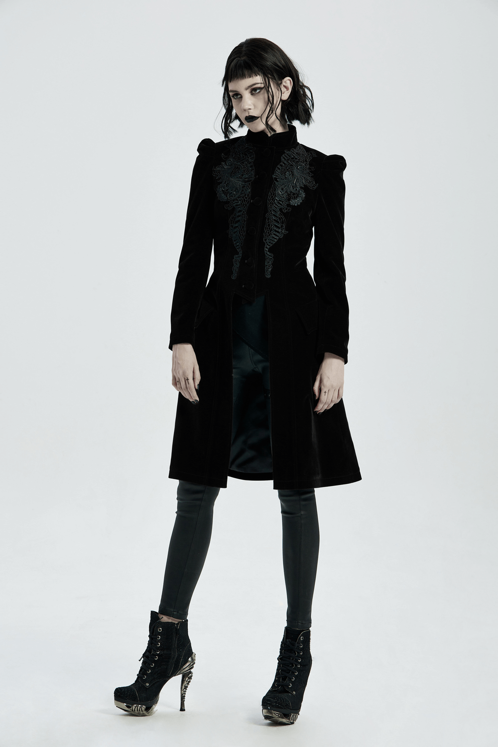 Elegant black velvet Gothic trench coat with lace-up back detail, perfect for a dramatic night out.