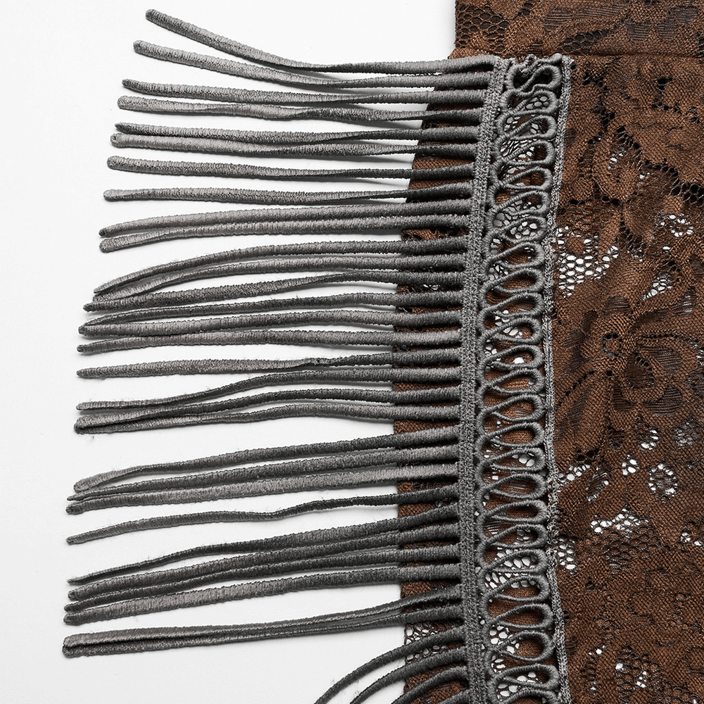 Close-up of elegant brown lace pants with dramatic gray fringe detailing, showcasing gothic style and intricate lace texture.