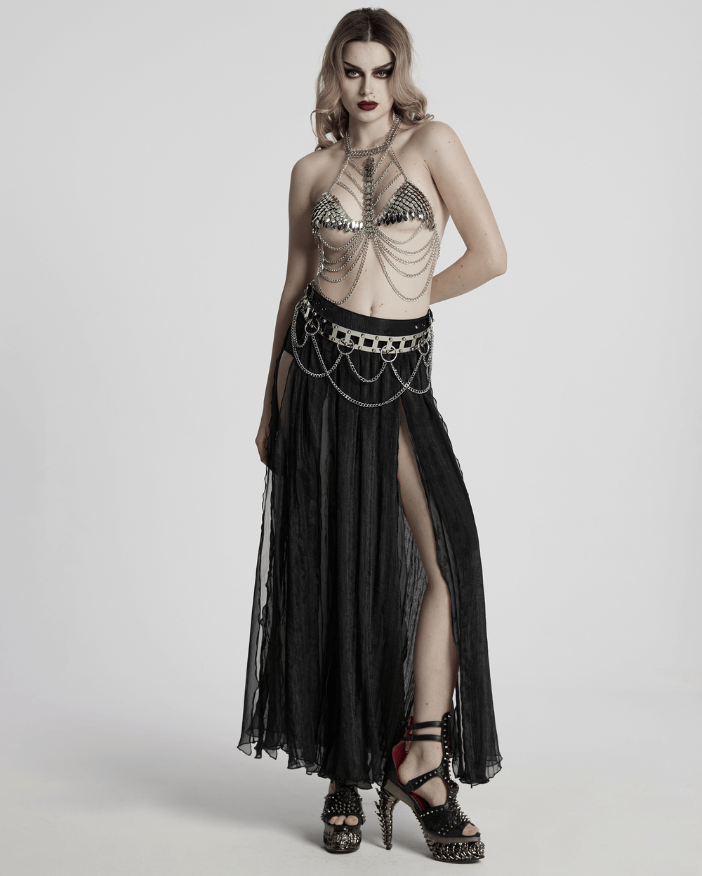 Elegant gothic chiffon skirt with lace and pleated details, paired with a stylish chained top and striking accessories.
