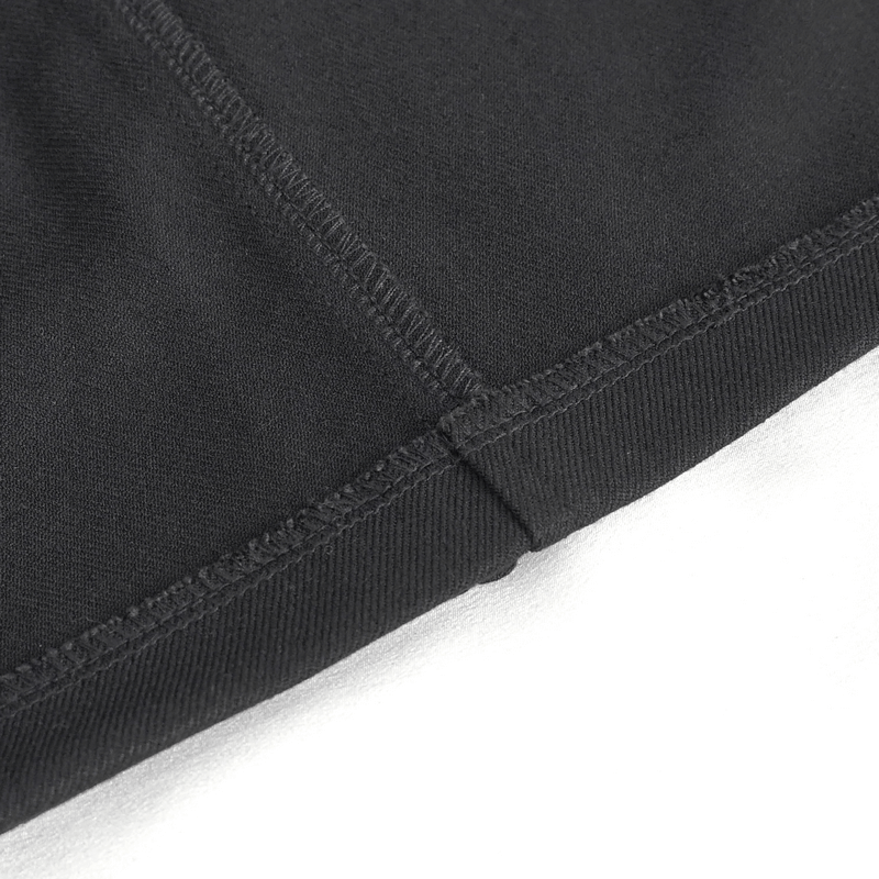 Close-up of the hem detail on a sleek black fabric skirt showcasing fine stitching for elegance.