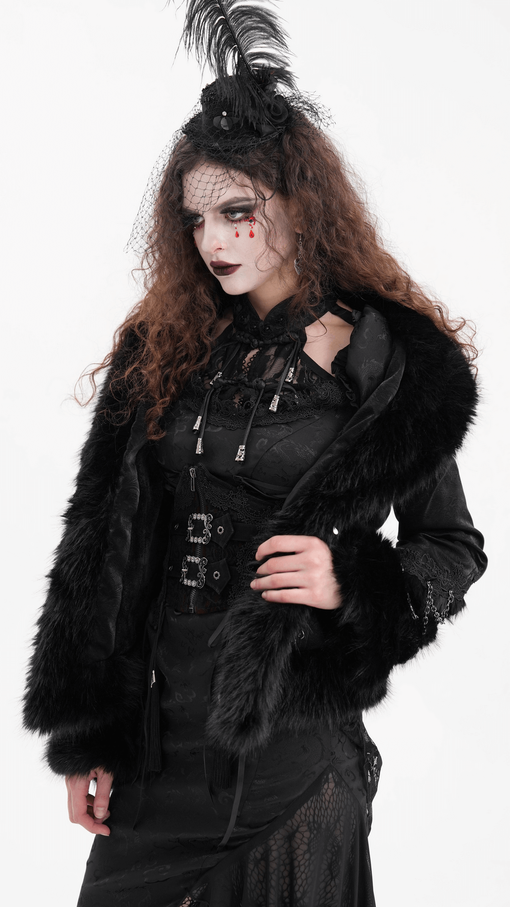 Elegant Gothic model wearing a black faux fur and lace jacket with chains, embodying dark elegance.