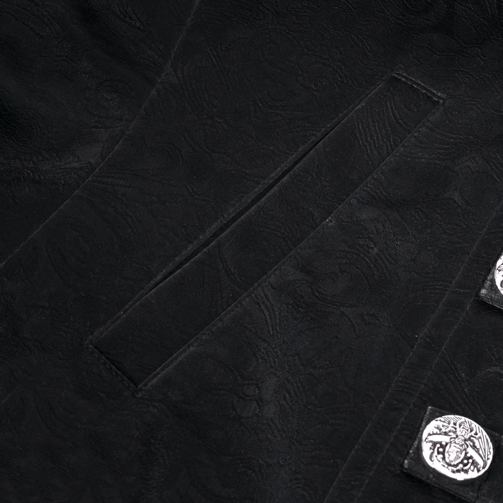 Close-up of intricate black fabric with lace details and silver buckles on a gothic jacket.