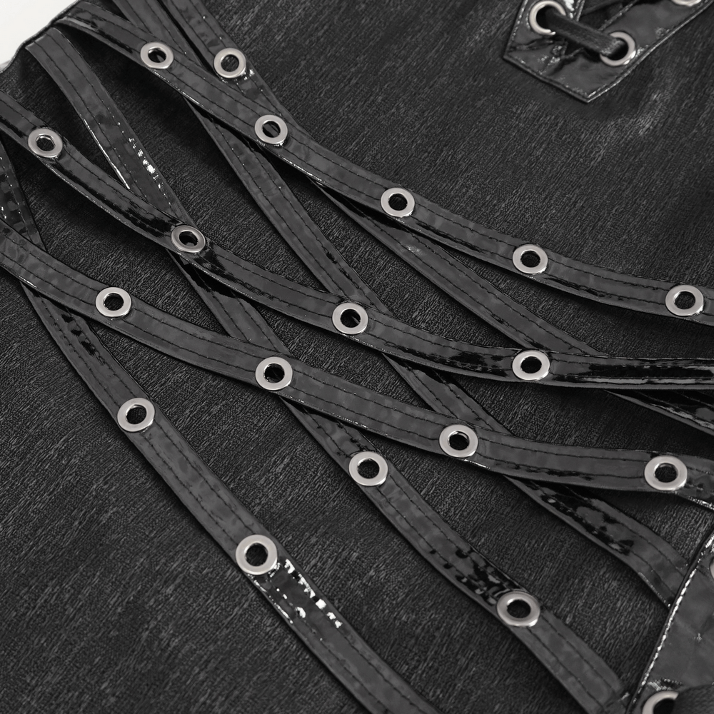 Close-up of lace-up detail on an elegant gothic maxi dress showcasing shiny black straps and eyelets.