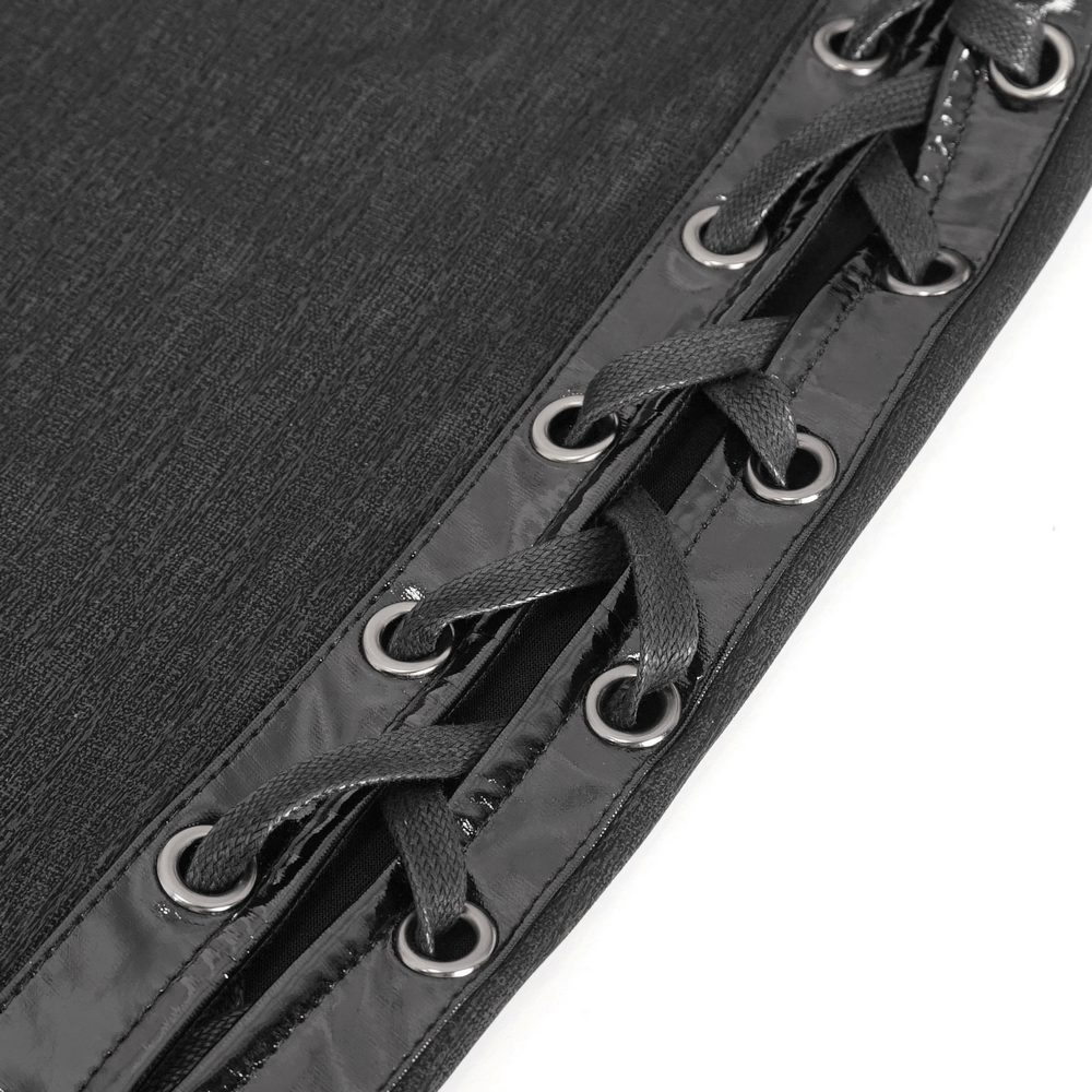 Close-up of lace-up detail on an elegant black gothic dress, showcasing chic eyelets and sleek lacing.