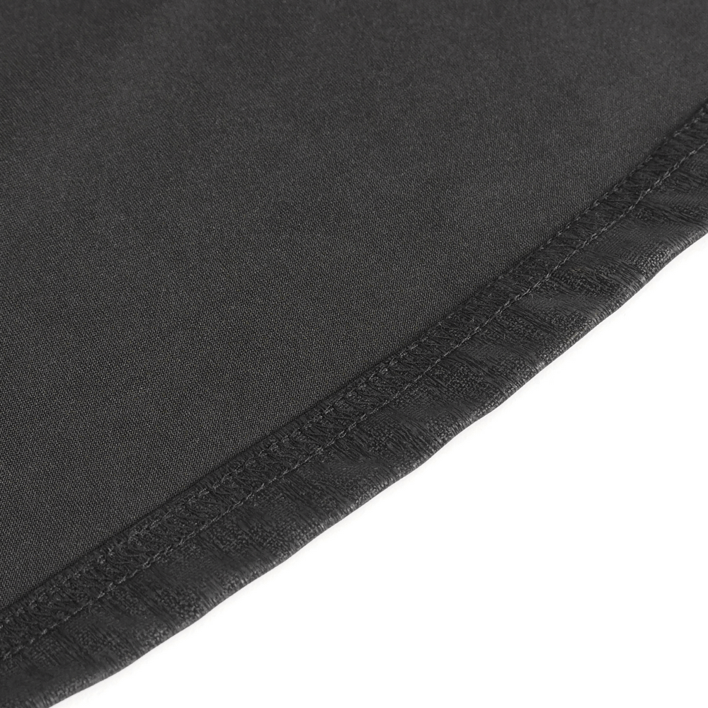 Close-up of the hemline of an elegant black maxi dress showcasing quality stitching and fabric texture.