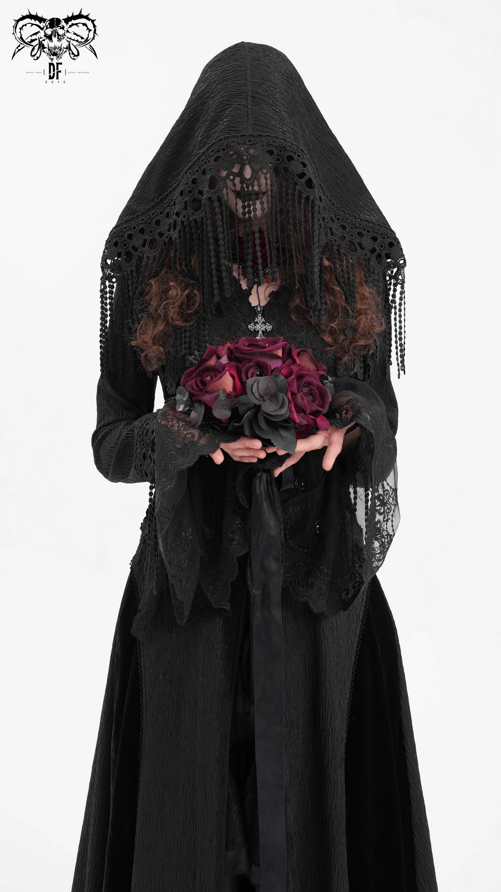 Woman in a black Gothic hooded cape, holding dark roses, showcasing Victorian elegance and dramatic lace details.