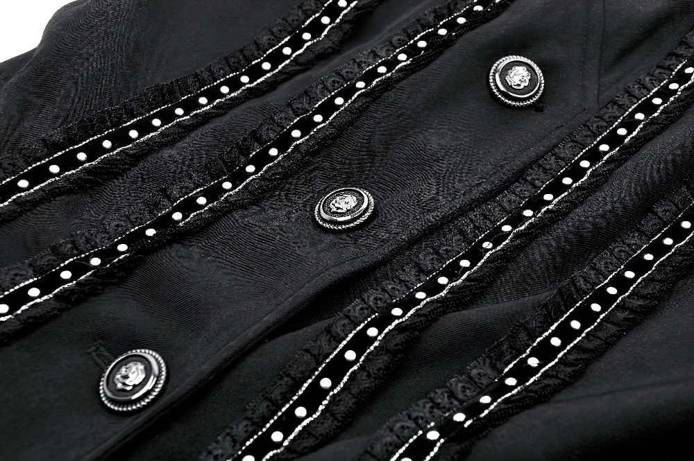 Close-up of elegant black gothic coat featuring intricate lace detailing and stylish buttons.