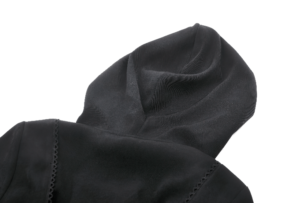 Close-up of the elegant hood of a black gothic trench coat with intricate lace detailing.