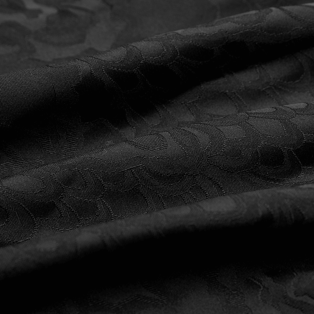 Close-up of luxurious black Gothic jacquard fabric, displaying intricate patterns and elegant texture.