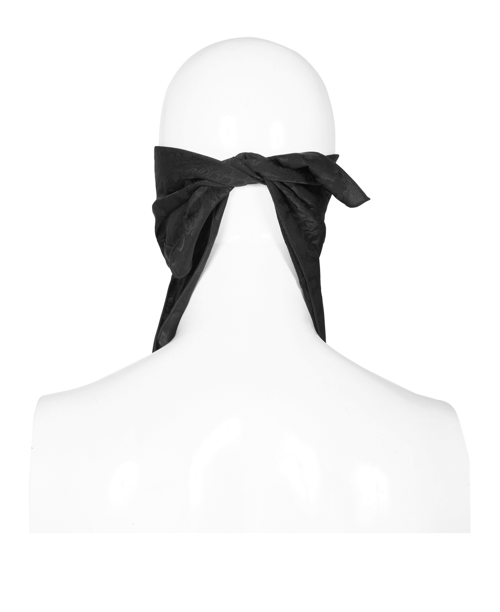 Back view of a stylish black Gothic jacquard triangular scarf tied elegantly for men.