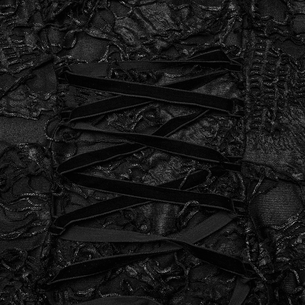 Close-up of intricate black lace with tattered fabric and adjustable drawstring, embodying gothic elegance.