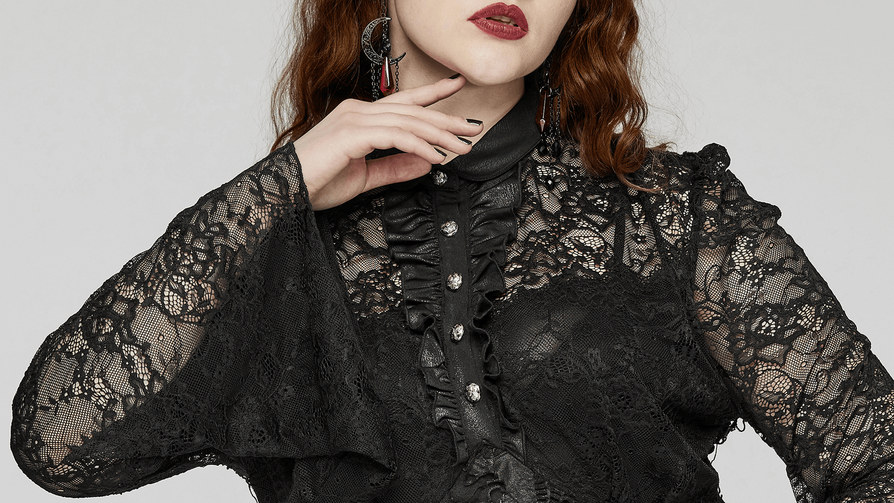 Close-up of elegant Gothic lace long sleeve dress with button details and ruffled neckline, showcasing intricate black lace design.