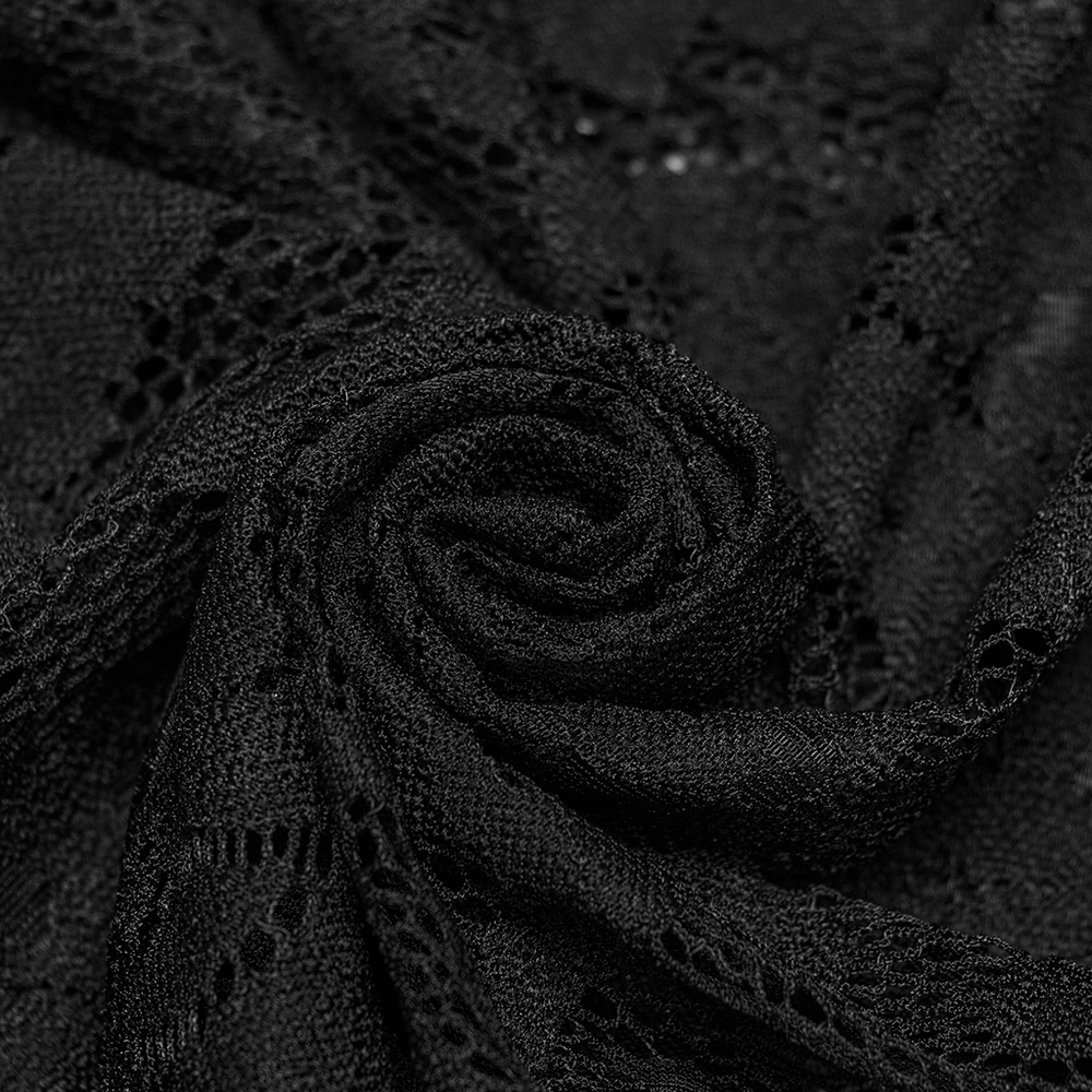 Close-up of intricate black lace fabric, showcasing delicate patterns perfect for gothic fashion.