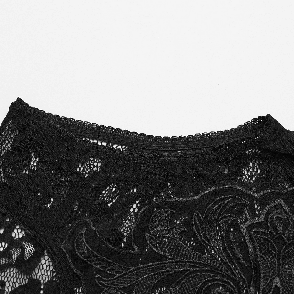 Close-up of intricate black lace design showcasing gothic elegance and detailed embroidery.